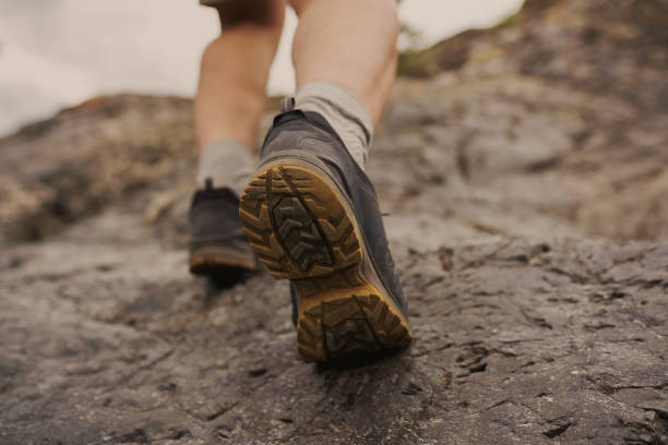istock foot steps in the mountains. double exposure photo 1424627187