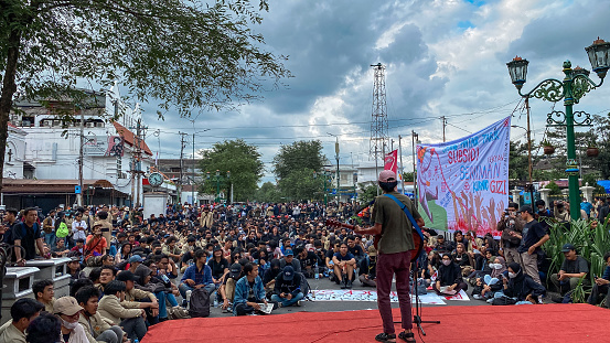 Yogyakarta, Indonesia - September 15, 2022: the students are doing a demonstration and singing against the government on Malioboro street