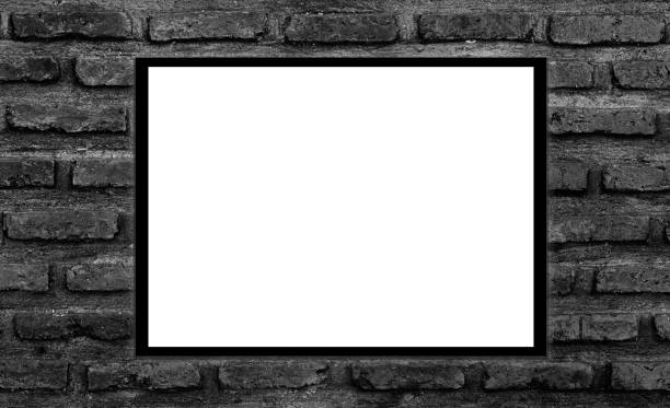 istock Mockup white picture frame on black brick wall background with clipping path 1424631486