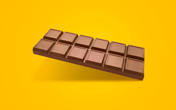 istock Cubes of milk chocolate bar isolated on orange background. 3d render 1424633662
