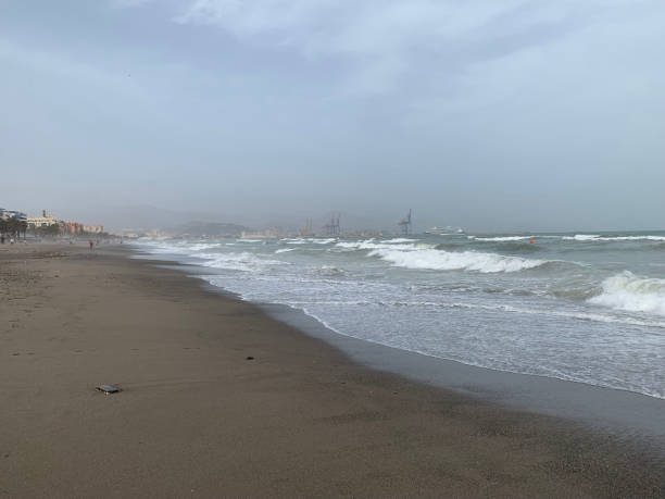 istock Restless sea on a cloudy day on the beach in Malaga 1424653568