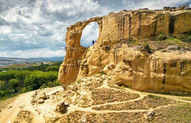 Mountain Ring in Kislovodsk, Stavropol Krai, Russia Mountain Ring in Kislovodsk, Stavropol Krai, Russia. Landscape of picturesque rock and sky in summer, scenery of window shape. Theme of nature, travel, hike and tourism in Caucasus Mineral Waters. caucasus stock pictures, royalty-free photos & images