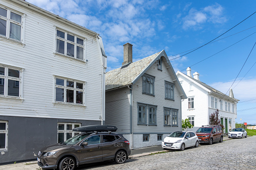 Haugesund, Norway.  Close-up of typical Norwegian house, with bright paintwork and wooden tiled roof.