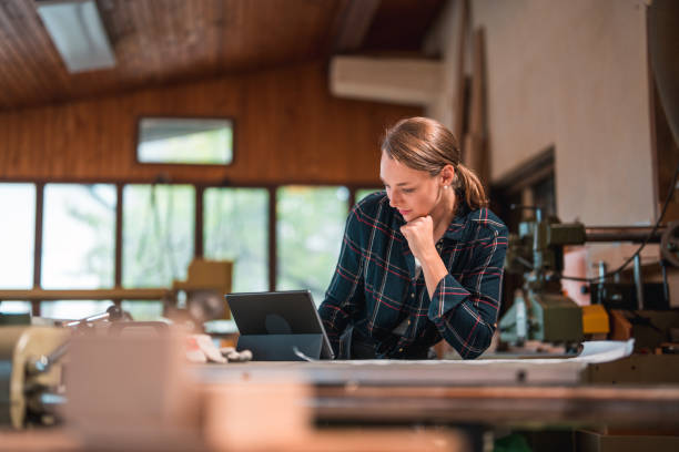 istock Smart Caucasian Female Looking at Digital Tablet and Thinking Next Steps 1424659360