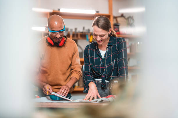 istock Carpenter Couple Using Casual Plaid Shirt or Sweater for Work 1424659370