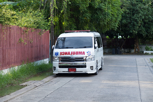 Thai ambulance parked in street of residential district in Bangkok Chatuchak