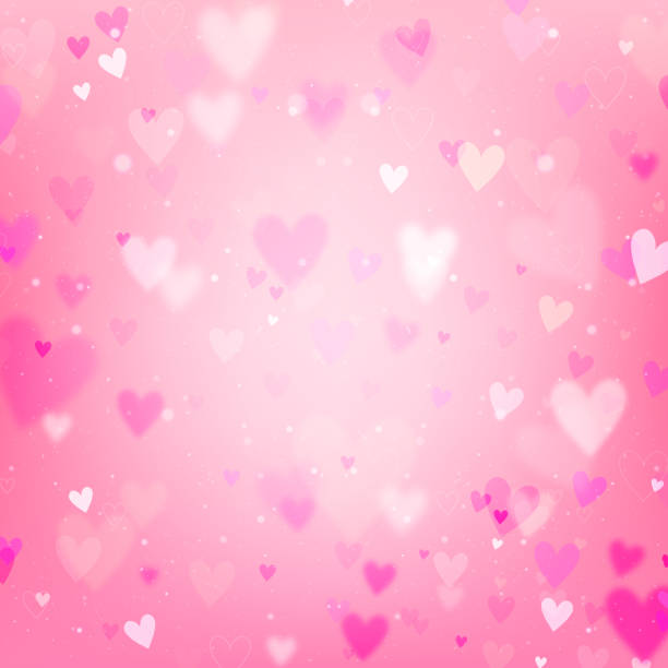 istock Valentines Day background with hearts and bokeh lights. Pink love background with hearts and sparkle lights. 1424664278