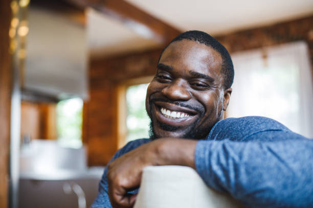 istock Portrait of joyful man looking at camera and smiling with confidence 1424671130