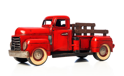 Red pick up truck toy isolated on white