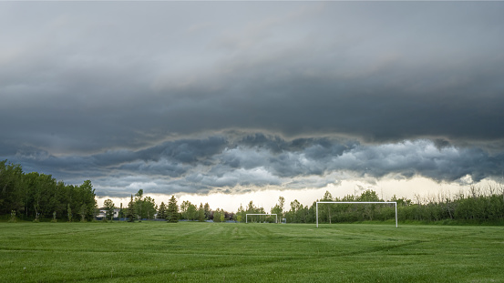 Heavy cloud storm front over playground soccer field