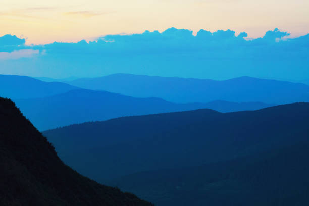 Blue mountain silhouettes. stock photo