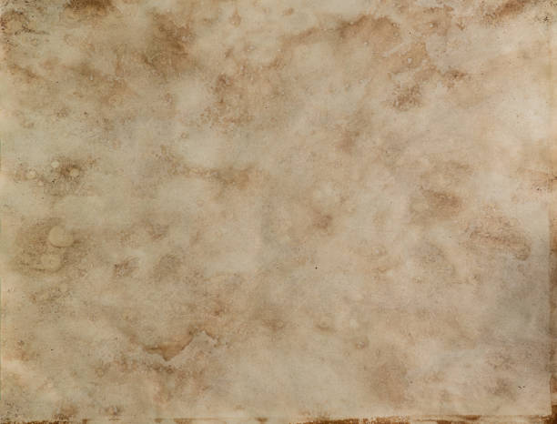 istock Old witch’s book empty page. Bewitched grimoire weathered page top view 1424685743