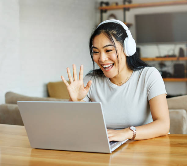 istock laptop  woman  computer headphone technology call video  communication  online  internet happy asian 1424689485