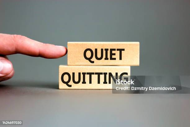 Quiet Quitting Symbol Concept Words Quiet Quitting On Wooden Blocks Beautiful Grey Table Grey Background Businessman Hand Business And Quiet Quitting Concept Copy Space Stock Photo - Download Image Now