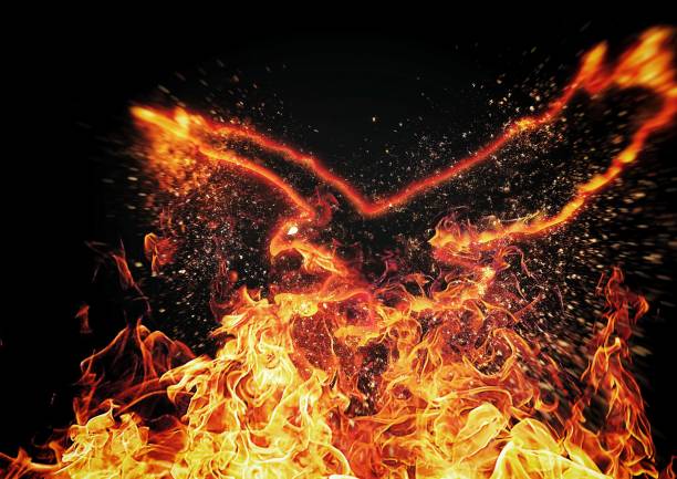 istock 3d illustration of a firebird flapping its wings in the dark 1424705729