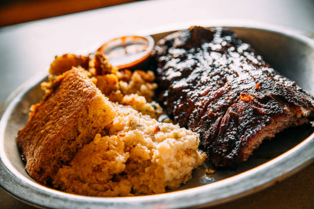 Delicious Half Rack of Ribs, Cornbread, and Corn Pudding for a Savory Lunch in Asheville, North Carolina stock photo