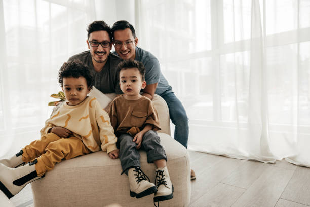 istock Same sex parenting - happy husbands 1424711483
