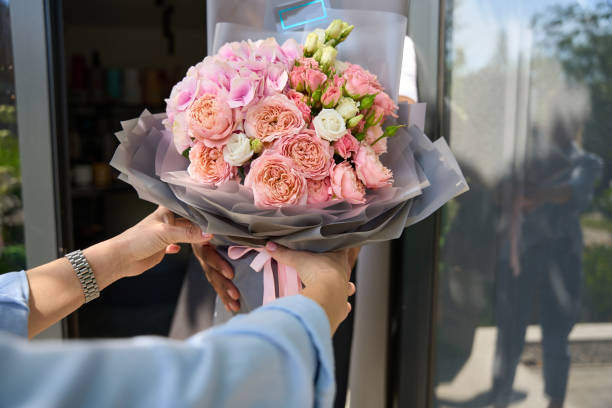 istock Girl takes a bouquet in her hands 1424722151
