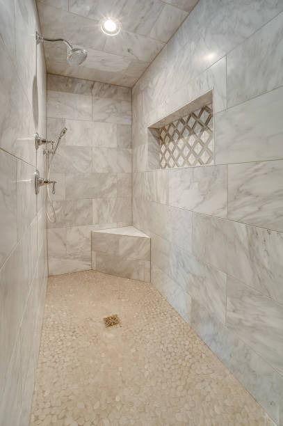 istock Luxurious shower with gray and white fancy tile 1424738401