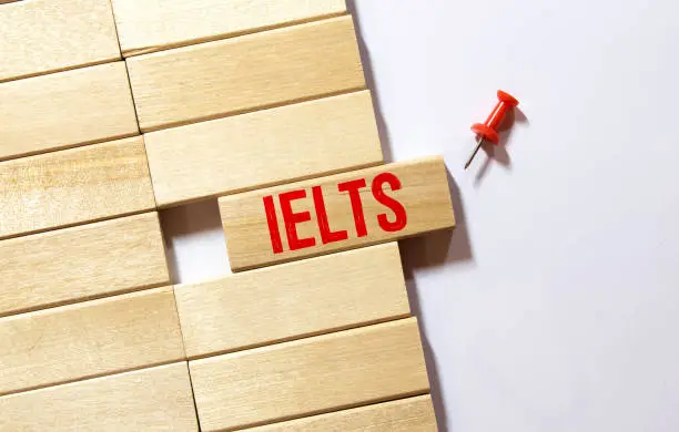 wooden blocks with the text ielts - International English Language Testing System