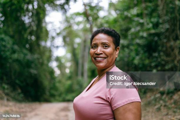 Portrait of mature woman enjoying nature park