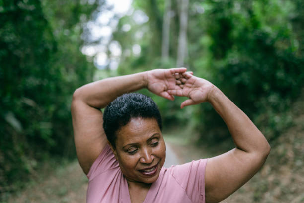 istock Woman doing relaxation exercise in the natural park 1424748643
