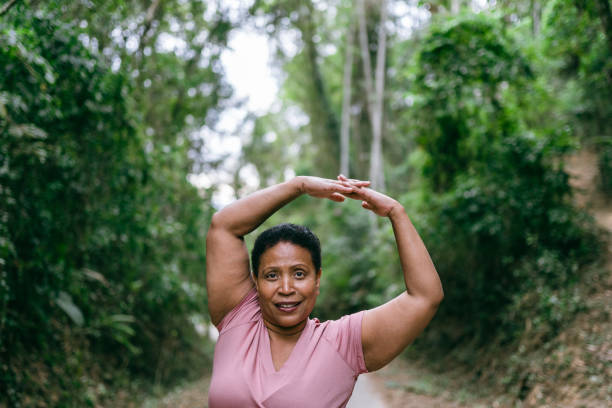 istock Woman doing relaxation exercise in the natural park 1424748644