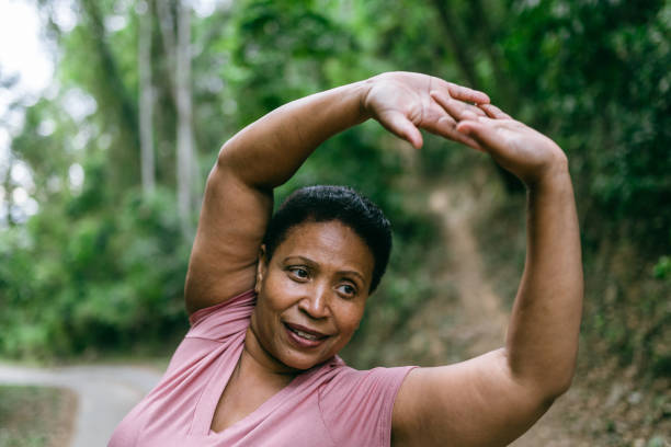 istock Woman doing relaxation exercise in the natural park 1424748654