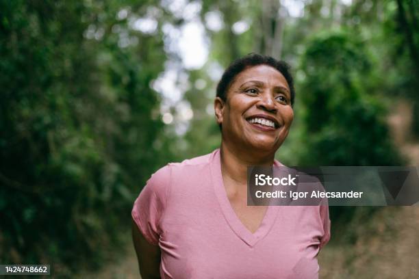 Mature Woman Contemplating Nature Stock Photo - Download Image Now - One Woman Only, Portrait, Mature Women