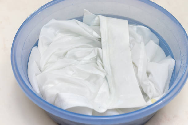 istock White clothes soaked in water in a basin 1424749584
