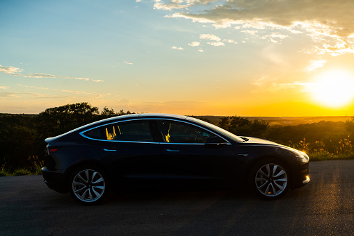 Austin , Texas , USA - 10/01/2022: Tesla Model 3 at sunrise for a bright future