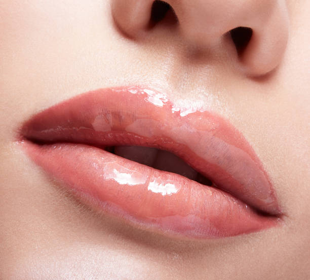 Closeup shot of female mouth with red lips stock photo