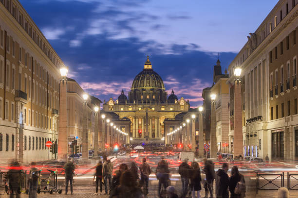 Vatican City, a city-state surrounded by Rome, Italy,  with St. Peter's Basilica at twilight.