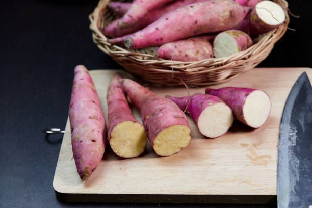 istock Fresh raw sweet potato on cutting board 1424775809
