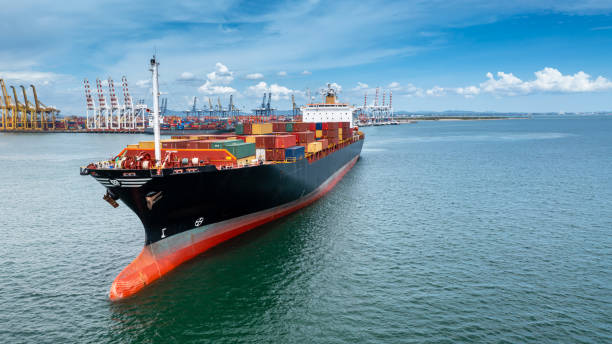 istock Container ship global business company freight shipping import export logistic and transportation by container ship, Container ship cargo freight shipping maritime transport international worldwide. 1424784311