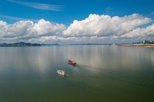 Drone view of tour boat moving on Ha Long bay, Ha Long city, Quang Ninh province, north Vietnam