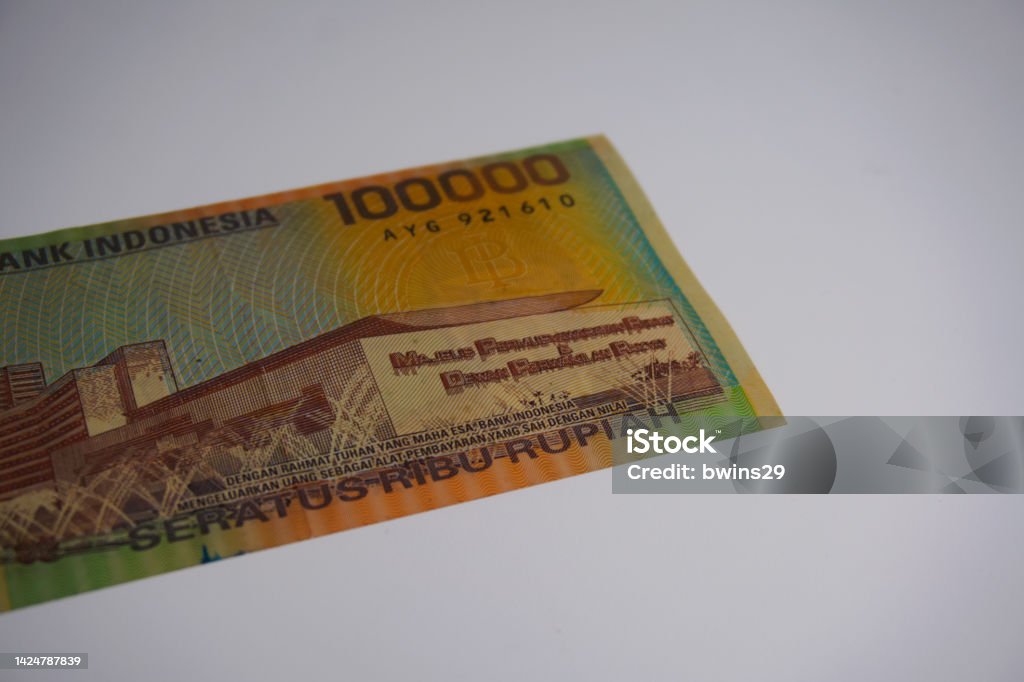 This polymer based banknote was released by Bank Indonesia on November 1, 1999 and was the first IDR 100,000 note issued in Indonesia, on white background. Asia Stock Photo
