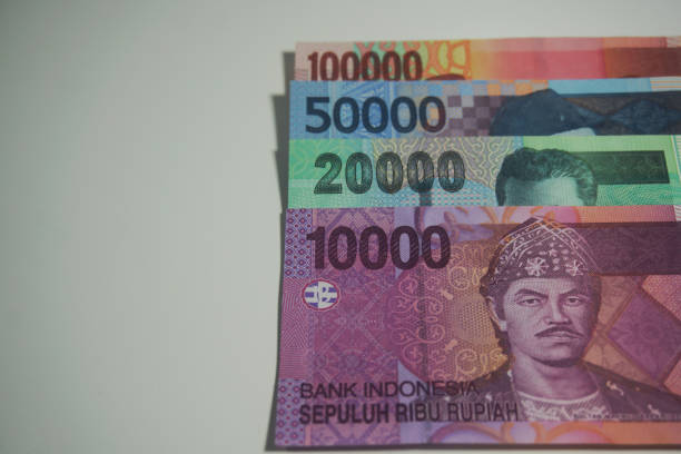 istock Selective focus of Indonesia Rupiah banknotes in white background. 1424790295