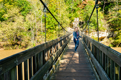 Suspension bridge on hiking trail at Turkey Run State Park, Autumn, Indiana, USA
