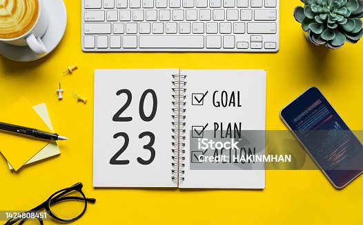istock 2023 new year goal,plan,action concepts with text on notepad and office accessories.Business management,Inspiration to success 1424808451