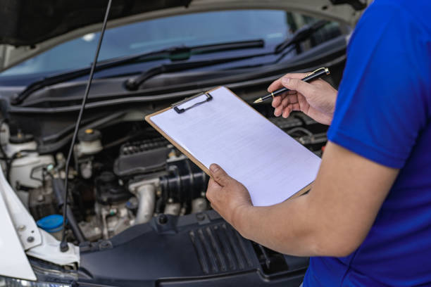 istock A young man checks his car for repairs before leaving. 1424813048