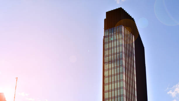 istock Modern glass facade against blue sky. 1424818793
