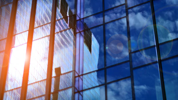 istock Modern glass facade against blue sky. 1424819559