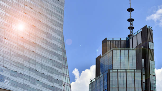 istock Modern glass facade against blue sky. 1424819893
