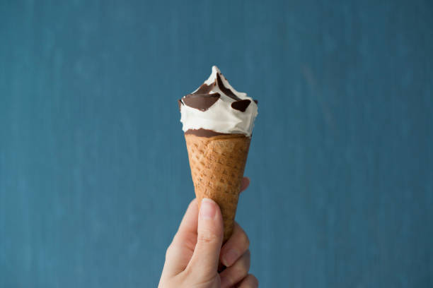istock Ice cream in a woman's hand 1424823246