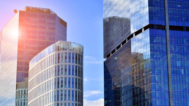 istock Modern glass facade against blue sky. 1424823491