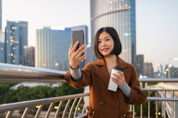 istock Asian woman making a video call on commute 1424825326
