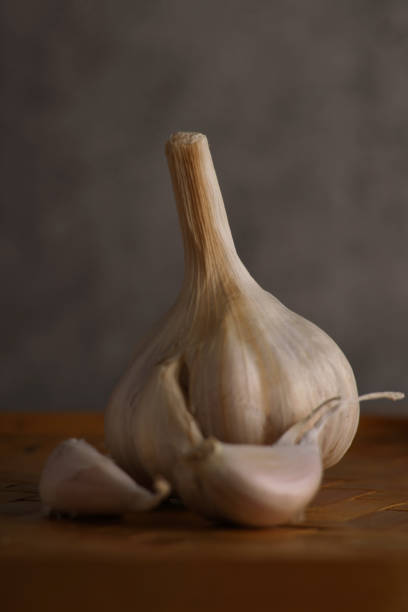 Organic Garlic In Wooden Tray stock photo