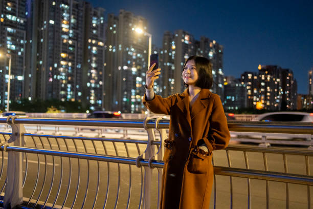 istock Asian woman making a video call on commute 1424831191