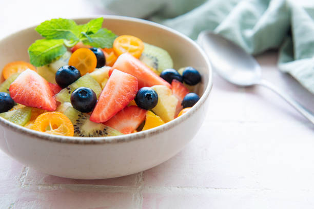istock Healthy fresh fruit salad in a bowl 1424833094